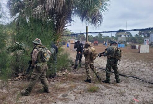 Airsoft Players flanking the other team at Palm Bay Paintball Park