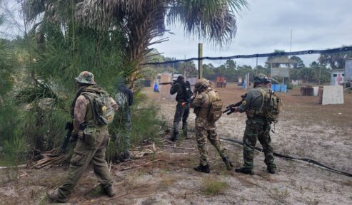 Airsoft Players flanking the other team at Palm Bay Paintball Park