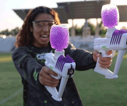 Girl shooting Gellyball gun